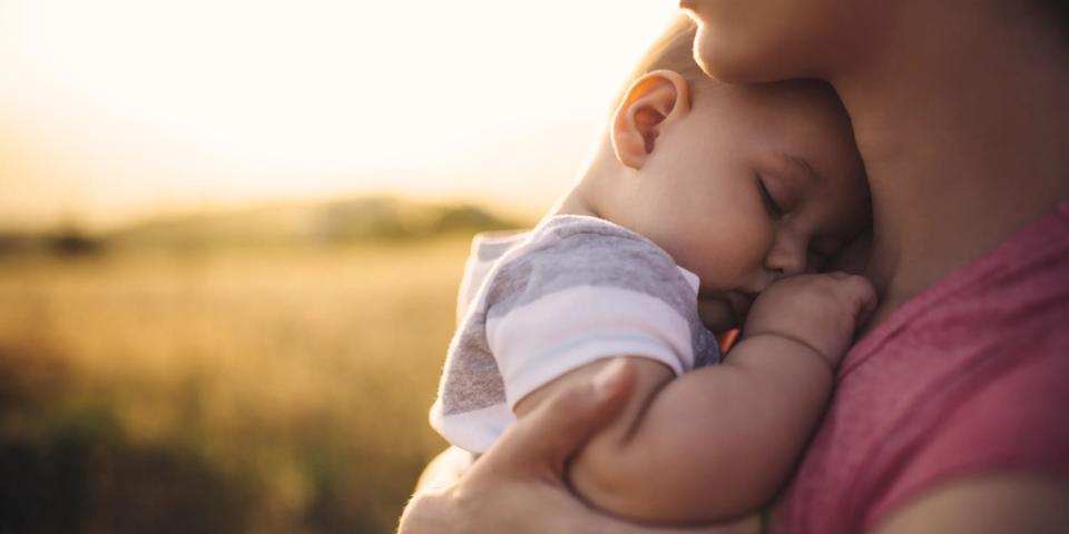 baby on mother